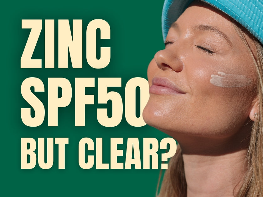 Woman applying clear zinc SPF50 sunscreen on her face with no white cast.
