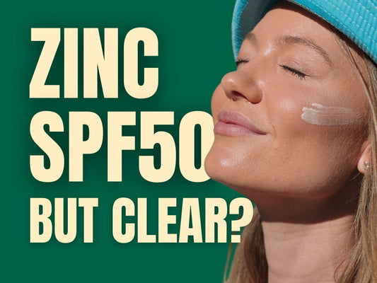 Woman applying clear zinc SPF50 sunscreen on her face with no white cast.